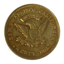 Round gold coin, eagle with wings spread holding olive branch and arrows in talons. Text around.