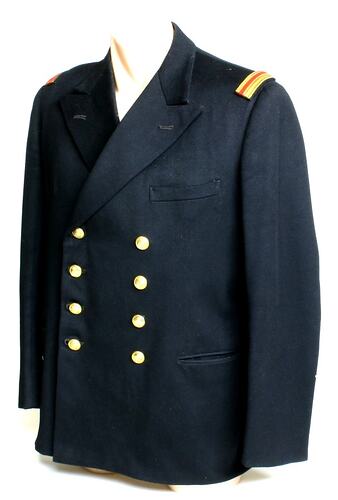 Navy double breasted jacket, one left breast pocket and two hip pockets.Brass buttons.