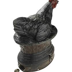 Metal mechanical hen from Cole's Book Arcade with small tin egg.