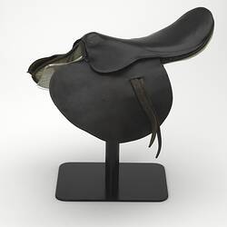Black saddle on stand.