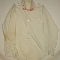 Off-white men's long sleeve, buttoned shirt with red paint splatters around collar.