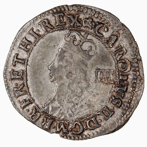 Coin, round, Crowned and draped bust of a king, facing left; text around.