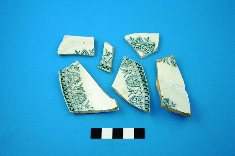Six earthenware fragments from saucer base and rim.