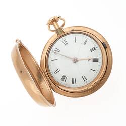 A round gold pocket watch, with door open and face visible.