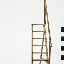 Front view of step ladder with handrail.