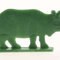 Green rhinoceros figurine, right view.