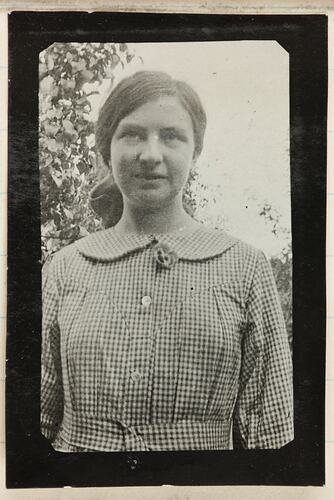 Woman wearing check patterned clothing.