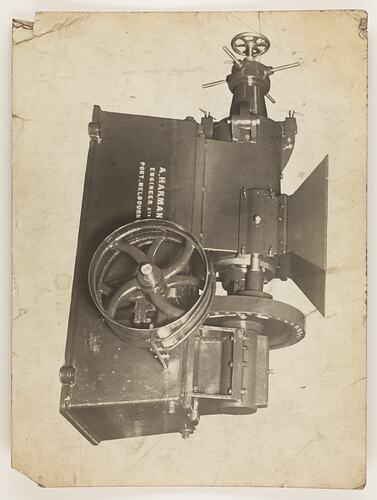 Monochrome photograph of an indutrial machine with funnel.
