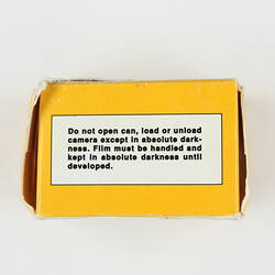 Film box with warning label.