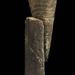 Cone-shaped belemnite fossil.