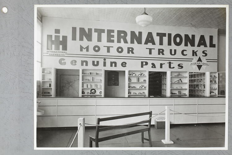 Monochrome photograph of a showroom interior.