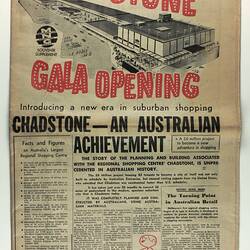 Front of newspaper with line drawing of shopping centre and red heading