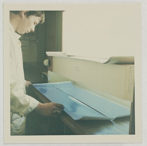 Worker Inspecting Photographic Paper in White Light, Kodak Factory, Coburg, circa 1960s