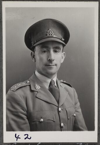 Studio portrait of man in military uniform.