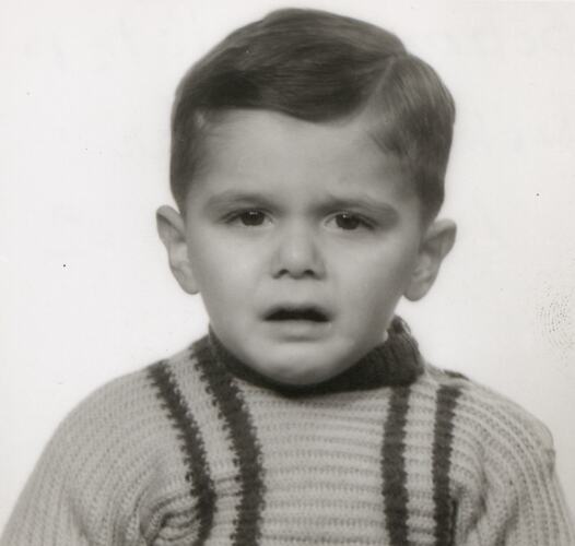 Head and shoulders portrait of young boy.