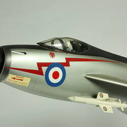 Silver model aeroplane. Blue, white and red rondels on wings and fuselage. Details of front section.