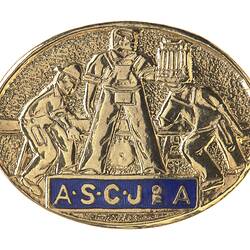 Brass oval badge with relief of 3 men working with timber and a saw. Blue enamel banner at base has gold text.