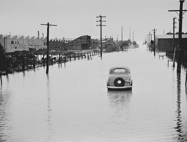 "STONEY CREEK IN FLOOD THROUGH FACTORY: 26TH FEB. 1946"