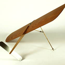 Wooden kite model with metal parts.