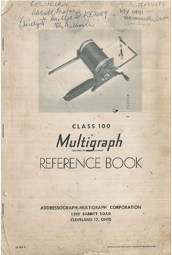 Front cover with photo of hand-cranked rotary duplicating machine. Black text below and handwritten annotation