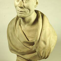 Beige coloured bust, three quarter view.