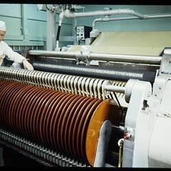 Slide - Kodak Australasia Pty Ltd, Worker Near the Rewind End of Film Slitting Machine, Building 4, Roll Film, Coburg, 1973
