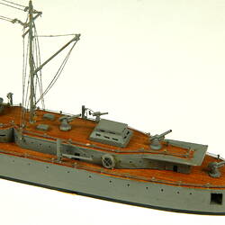 Naval ship with two masts, detail of rear of deck.