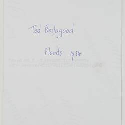 Back of photograph with handwritten text in blue ink.