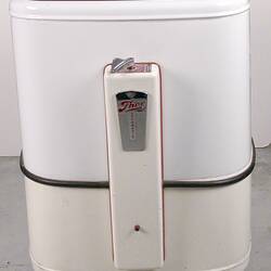 Rectangular, box-shaped washing machine. Rounded edges, white enamel coating and green lid.