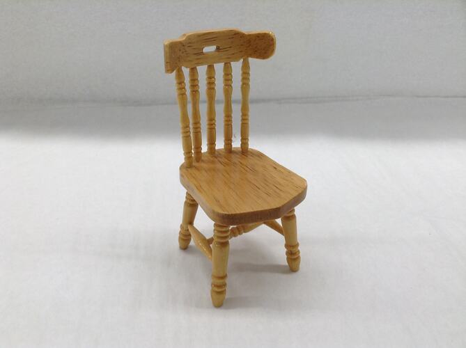 Miniature wooden chair.