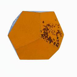 Wooden crystal model painted orange and blue.