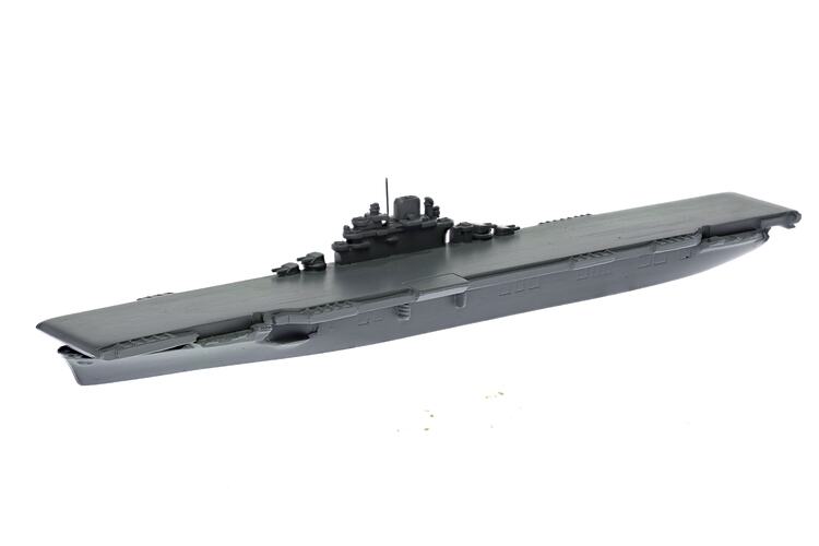 Grey ship model with mostly flat deck.