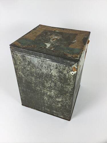 Metal box with lid. Scuff marks.