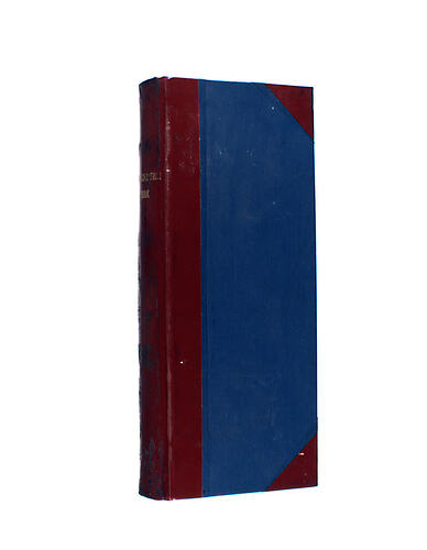 Book book with red spine and corners.
