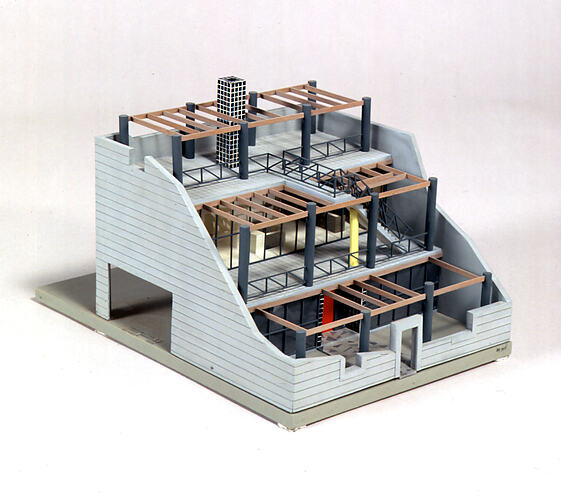 Cut away architectural model of a three story house.