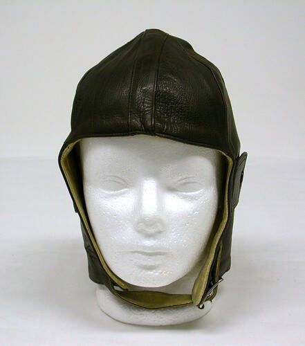 Brown leather aviator's helmet.