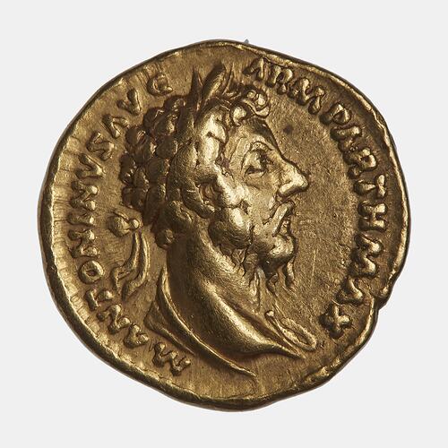 Round gold coin. Draped, wreathed bust of man facing right. Text around.
