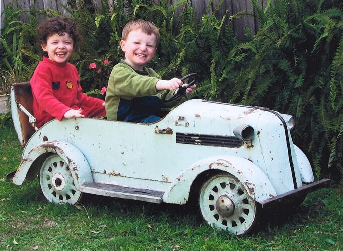 Digital Photograph - Boy & Girl in Family Toy Car, Highett, 2006