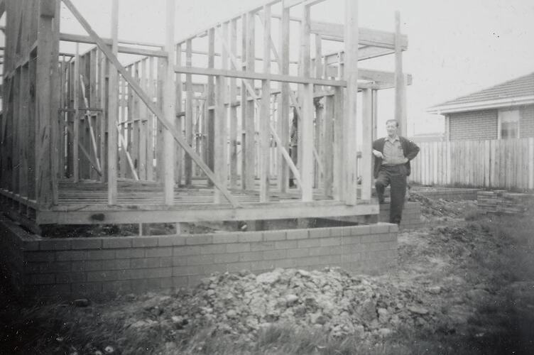 Digital Photograph - Man Inspecting House Frame, House Building Site, Gladstone Park, 1967
