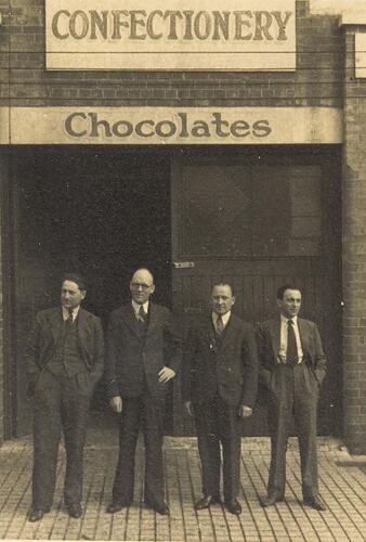 Digital Photograph - Four Men Standing outside Bush's Confectionary Factory, Richmond, circa 1935