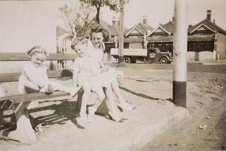 Digital Photograph - Mother, Boy & Girl Sitting on Public Seat, Middle Park, 1949