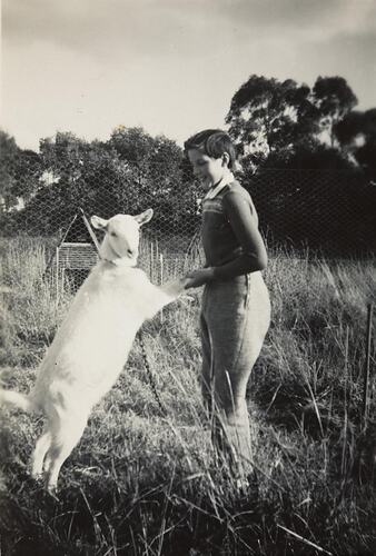 Digital Photograph - Girl Playing with Goat, in Field, Springvale South, 1957