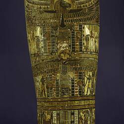 Egyptian coffin, lid decorated with face and colourful patterns and pictures.