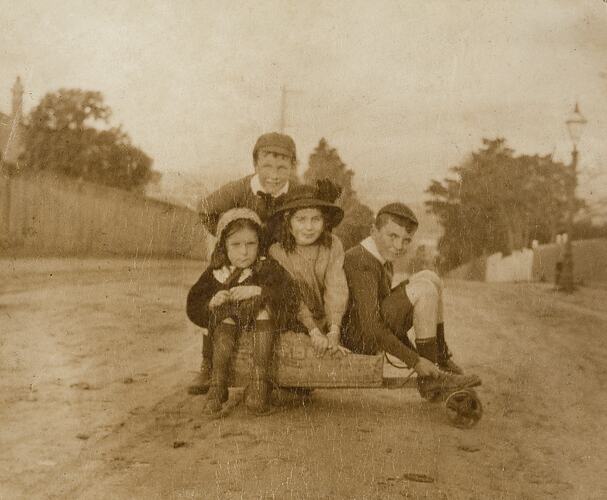 Two Boys & Two Girls Crowded onto Wooden Billy Cart on Street, Malvern, 1912