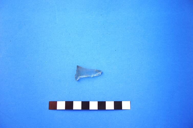 Fragment of light green glass bottle.