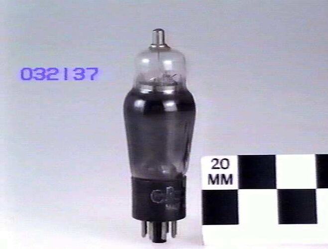 A photograph of an electronic valve (a bit like a glass lightbulb) on a white background, about 160mm tall, wi