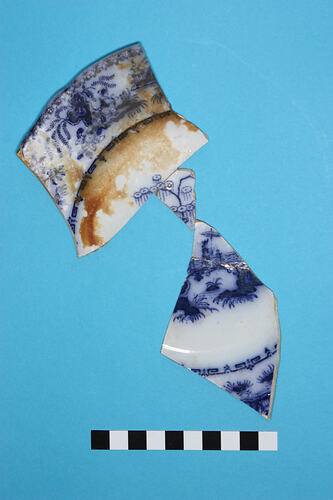 Plate - Whiteware, Blue flow, transfer-printed, Nankin, England, after 1835 (Fragment)