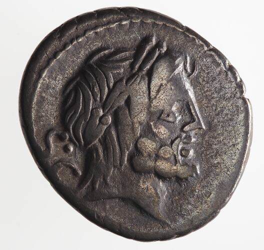 Round coin, aged, bearded male profile, facing right, wearing headdress.