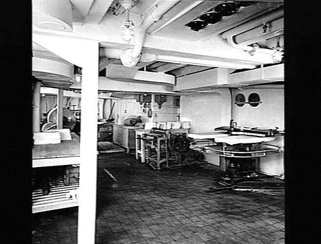 Ship interior. Laundry area with clothes press.