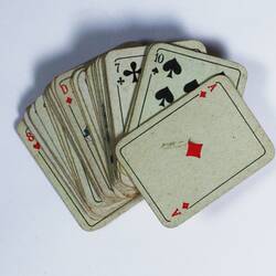 Deck of playing cards, spread out in fan shape.